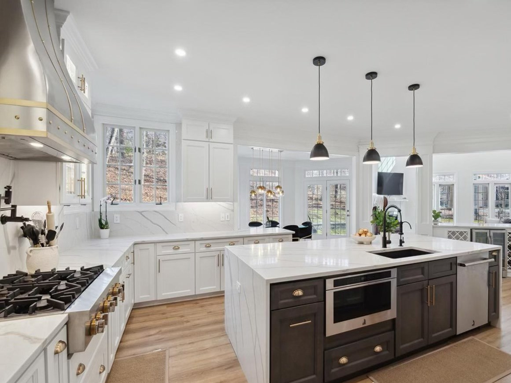 Kitchen remodeling customers often choose an open kitchen concept with white countertops to brighten the room